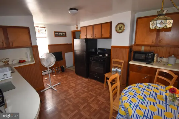 a work room with furniture and musical instruments