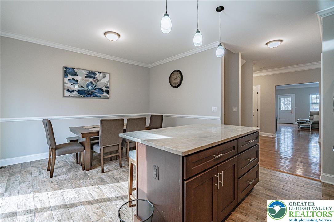 1490 East 7th Street Bethlehem, PA 18015 - Photo 11 of 22 a view of kitchen island with furniture and wooden floor