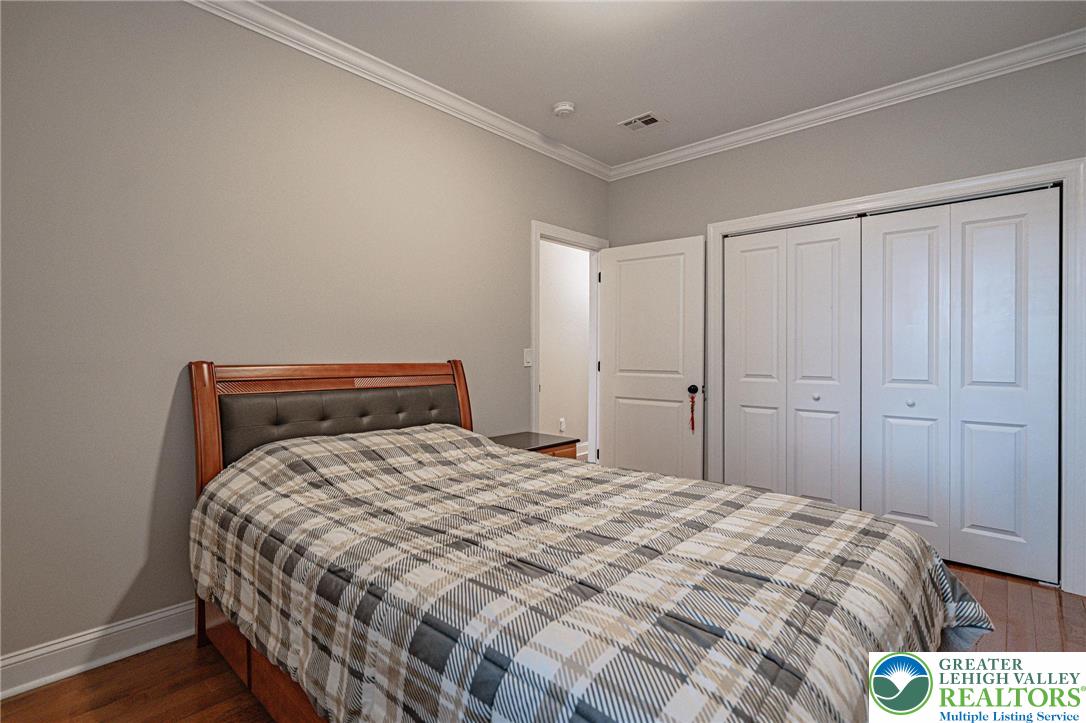 1490 East 7th Street Bethlehem, PA 18015 - Photo 18 of 22 a bedroom with a bed and a closet