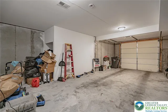 a view of a garage with a bike and car