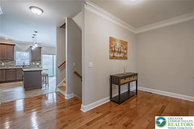 a view of kitchen with wooden floor and electronic appliances
