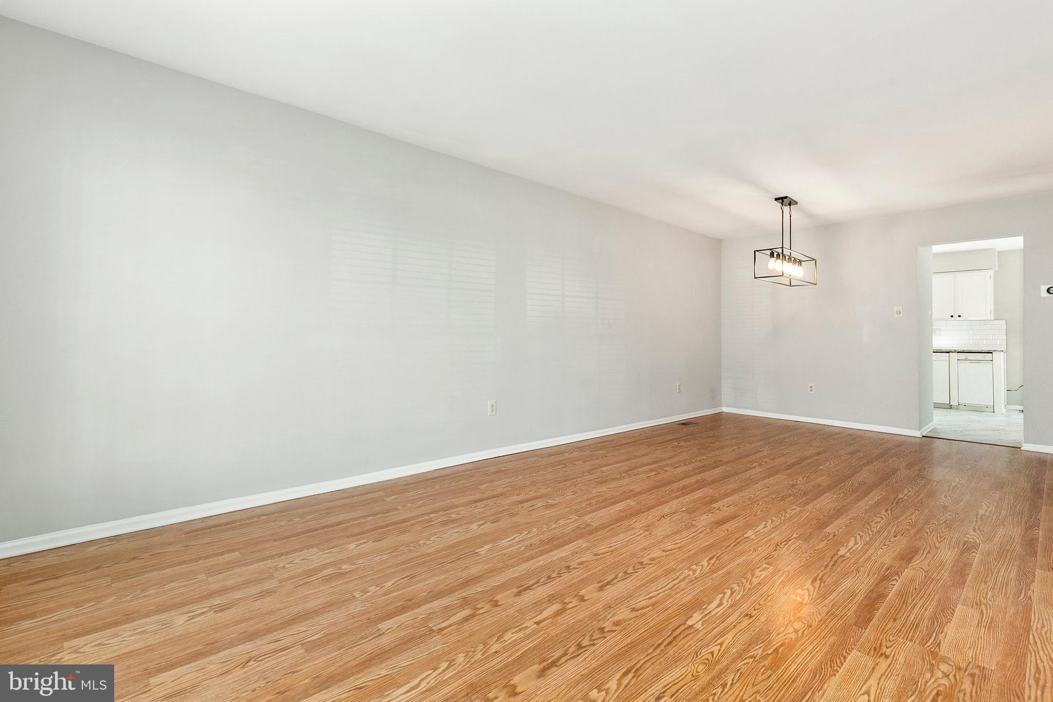 4762 Leyden Way Ellicott City, MD 21042 - Photo 13 of 58 a view of empty room with wooden floor