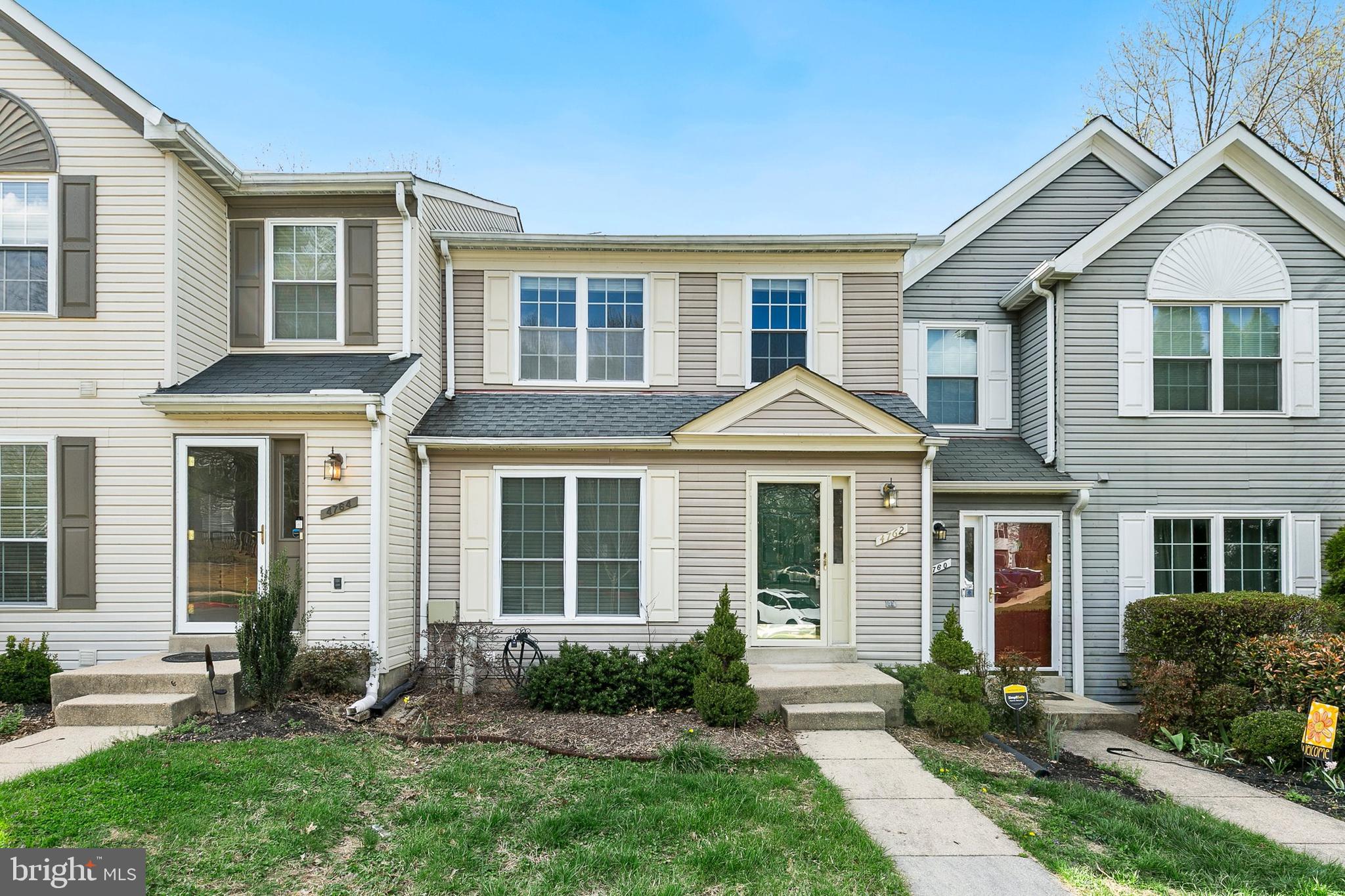 4762 Leyden Way Ellicott City, MD 21042 - Photo 2 of 58 a front view of a house with a yard
