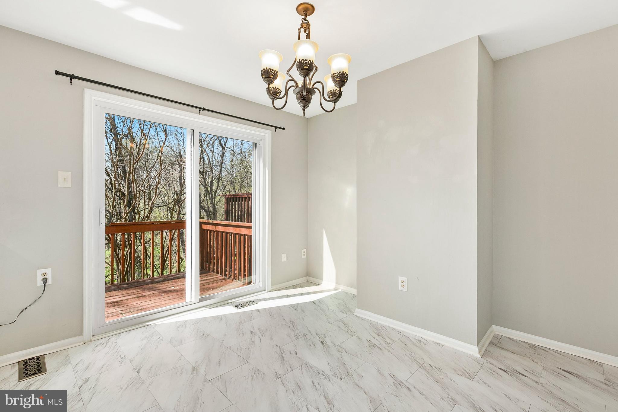4762 Leyden Way Ellicott City, MD 21042 - Photo 21 of 58 a view of an empty room with a window