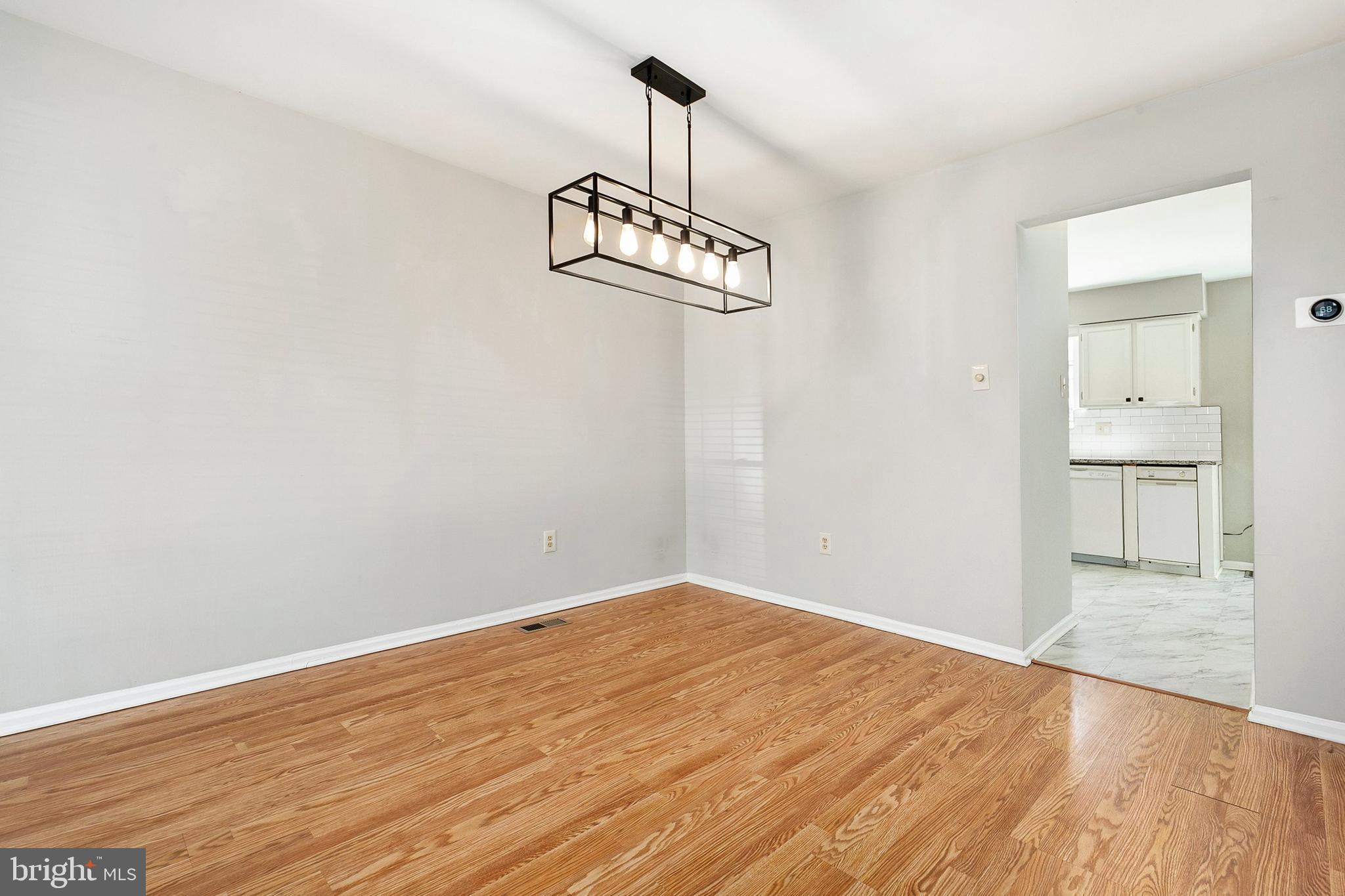 4762 Leyden Way Ellicott City, MD 21042 - Photo 23 of 58 a view of a room with wooden floor