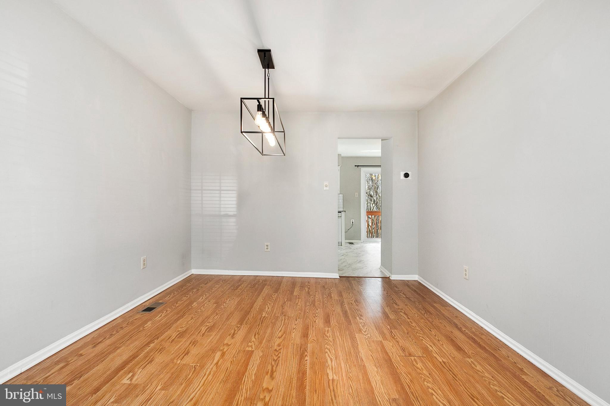 4762 Leyden Way Ellicott City, MD 21042 - Photo 24 of 58 a view of empty room with wooden floor