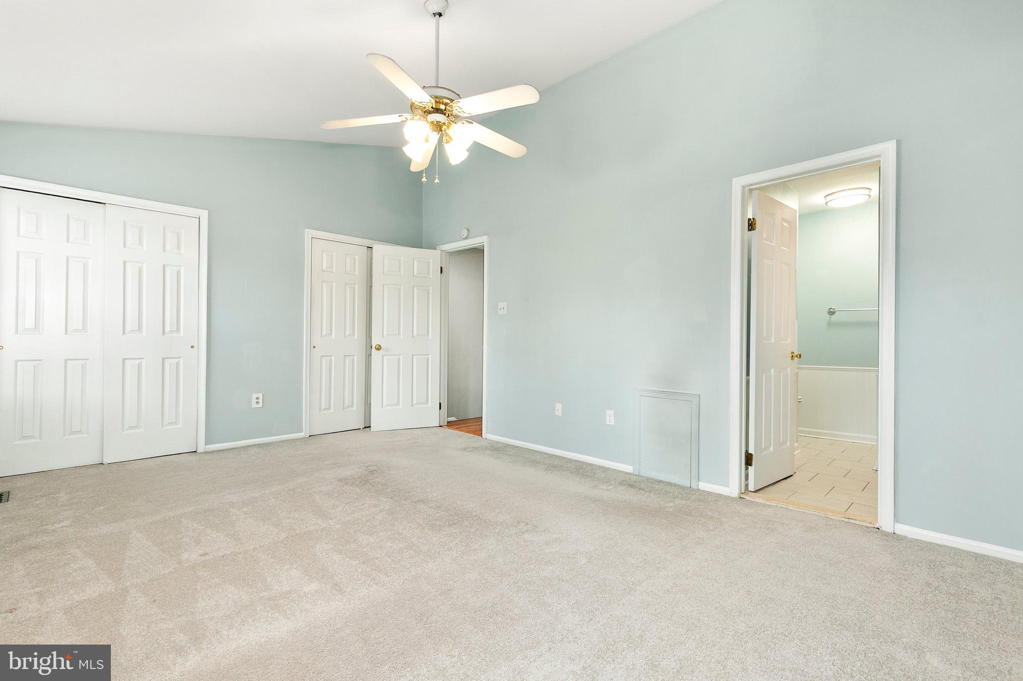 4762 Leyden Way Ellicott City, MD 21042 - Photo 28 of 58 a view of an empty room with a chandelier fan