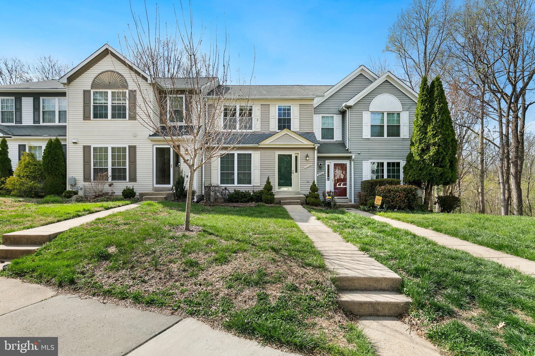 4762 Leyden Way Ellicott City, MD 21042 - Photo 3 of 58 a front view of a house with a yard