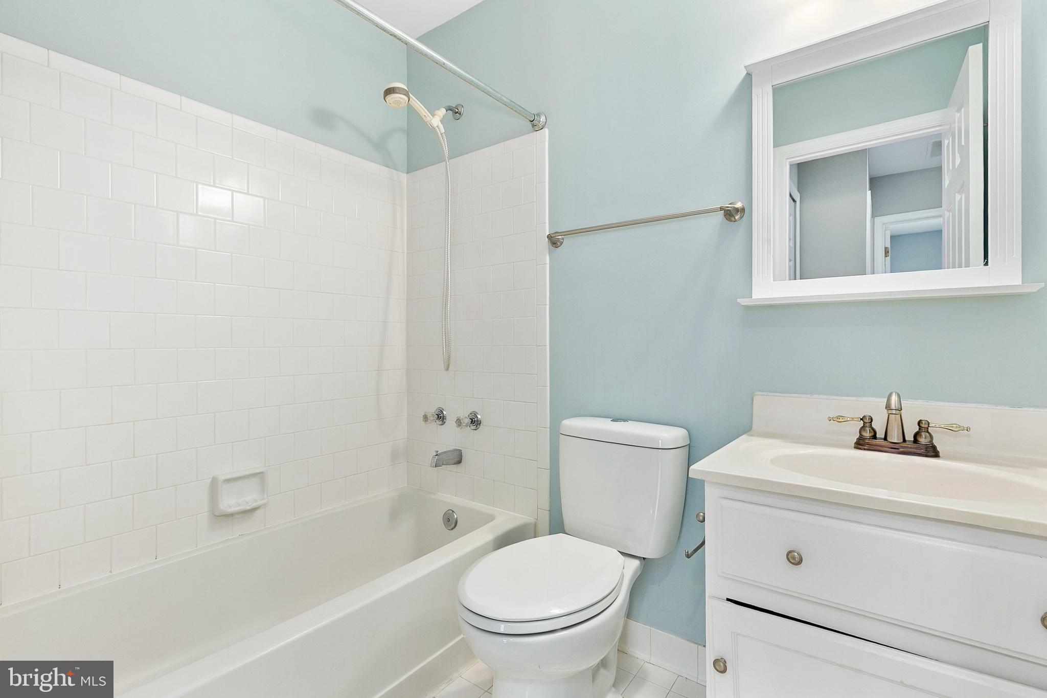 4762 Leyden Way Ellicott City, MD 21042 - Photo 37 of 58 a bathroom with a sink toilet and shower