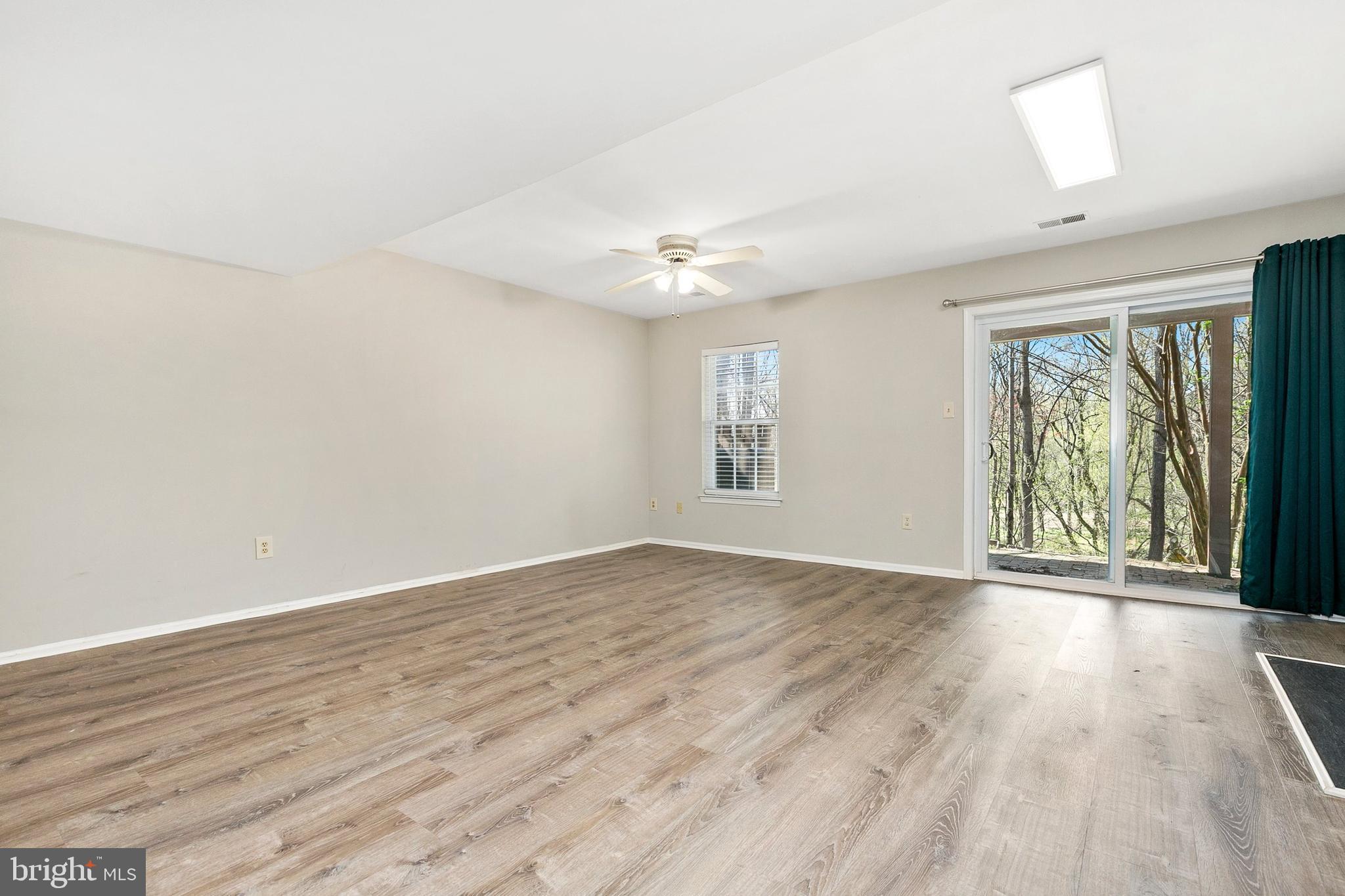4762 Leyden Way Ellicott City, MD 21042 - Photo 40 of 58 wooden floor in an empty room with a window