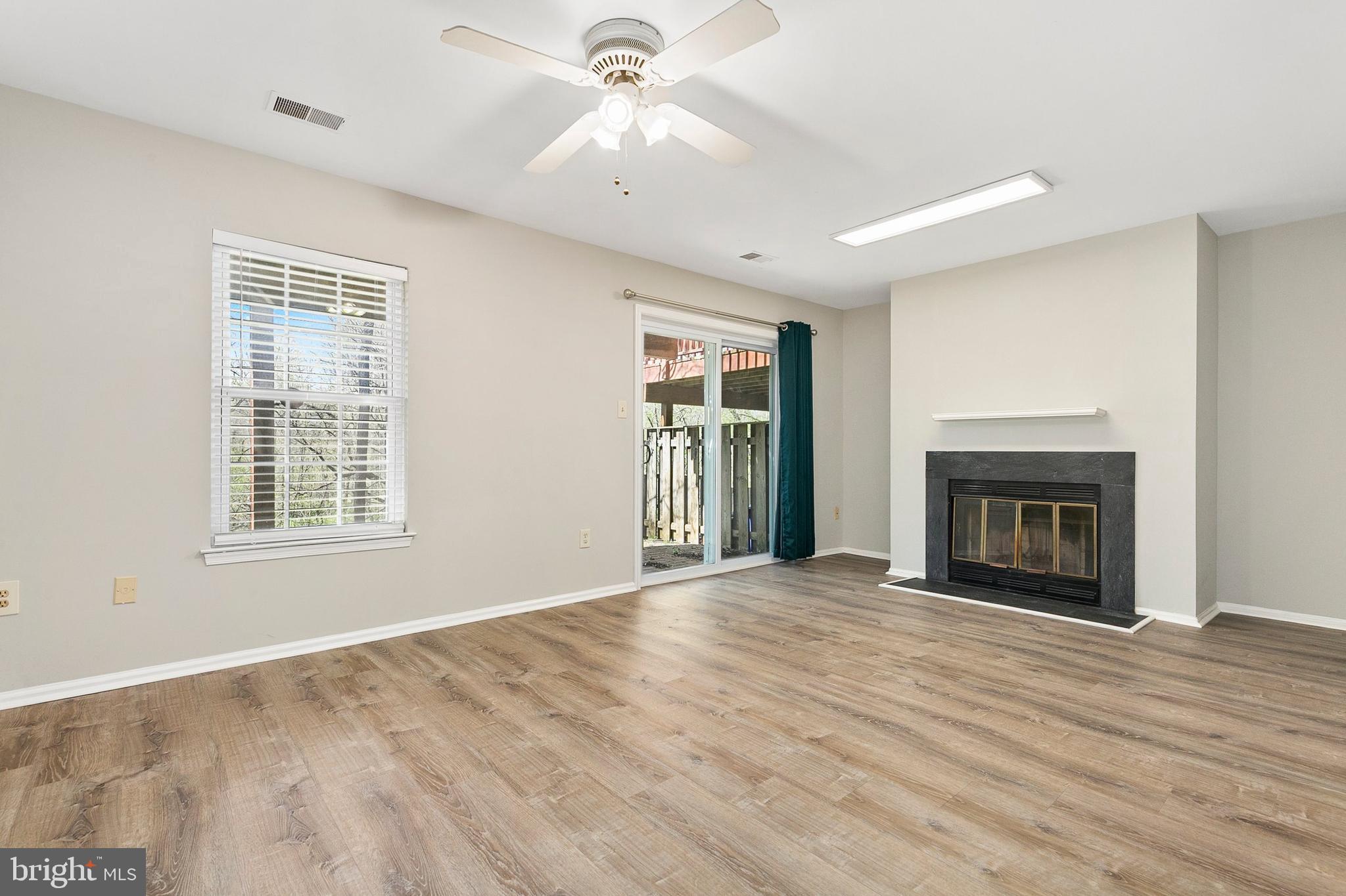 4762 Leyden Way Ellicott City, MD 21042 - Photo 43 of 58 a view of an empty room with window and fire place