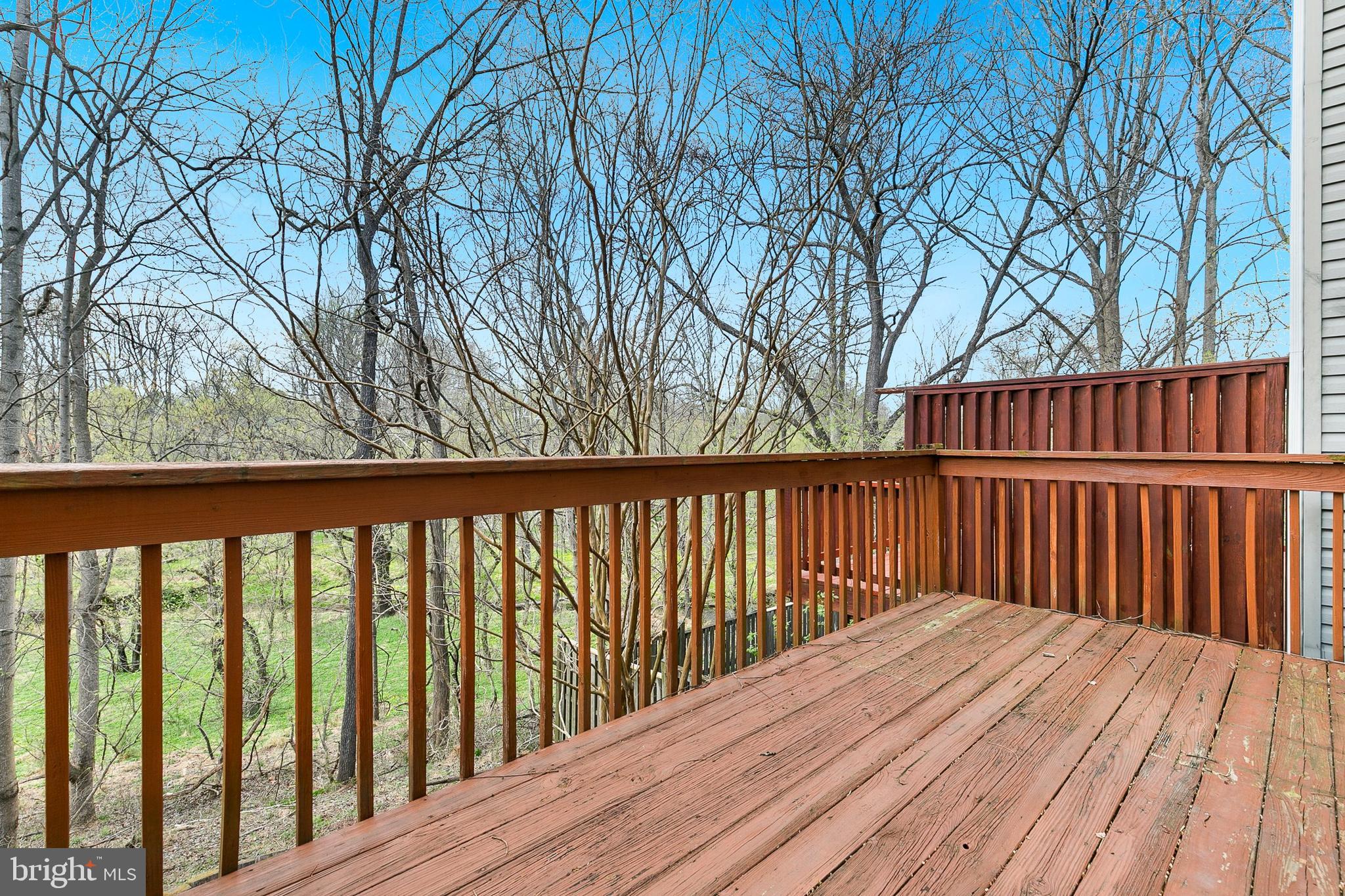 4762 Leyden Way Ellicott City, MD 21042 - Photo 49 of 58 a balcony with wooden floor and fence