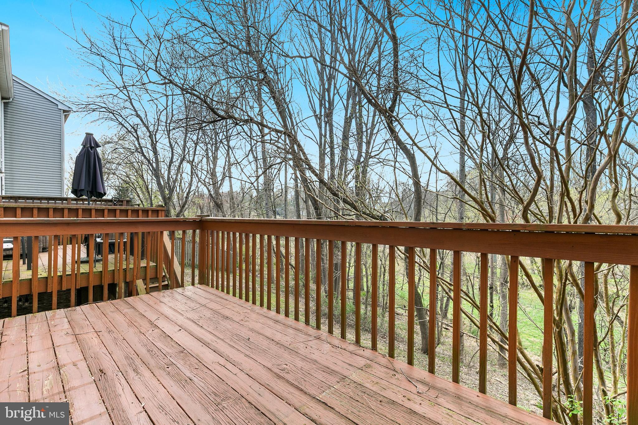 4762 Leyden Way Ellicott City, MD 21042 - Photo 50 of 58 a balcony with wooden floor and fence