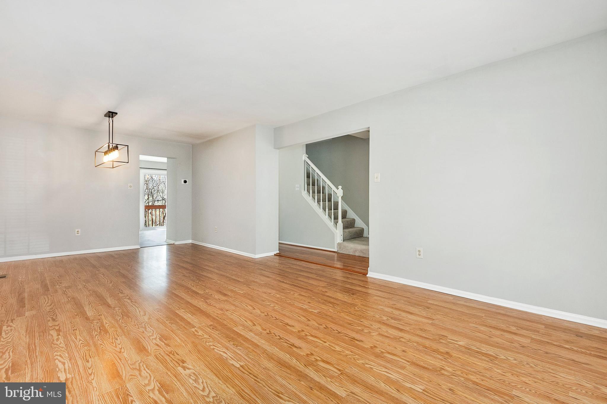4762 Leyden Way Ellicott City, MD 21042 - Photo 8 of 58 an empty room with wooden floor and windows