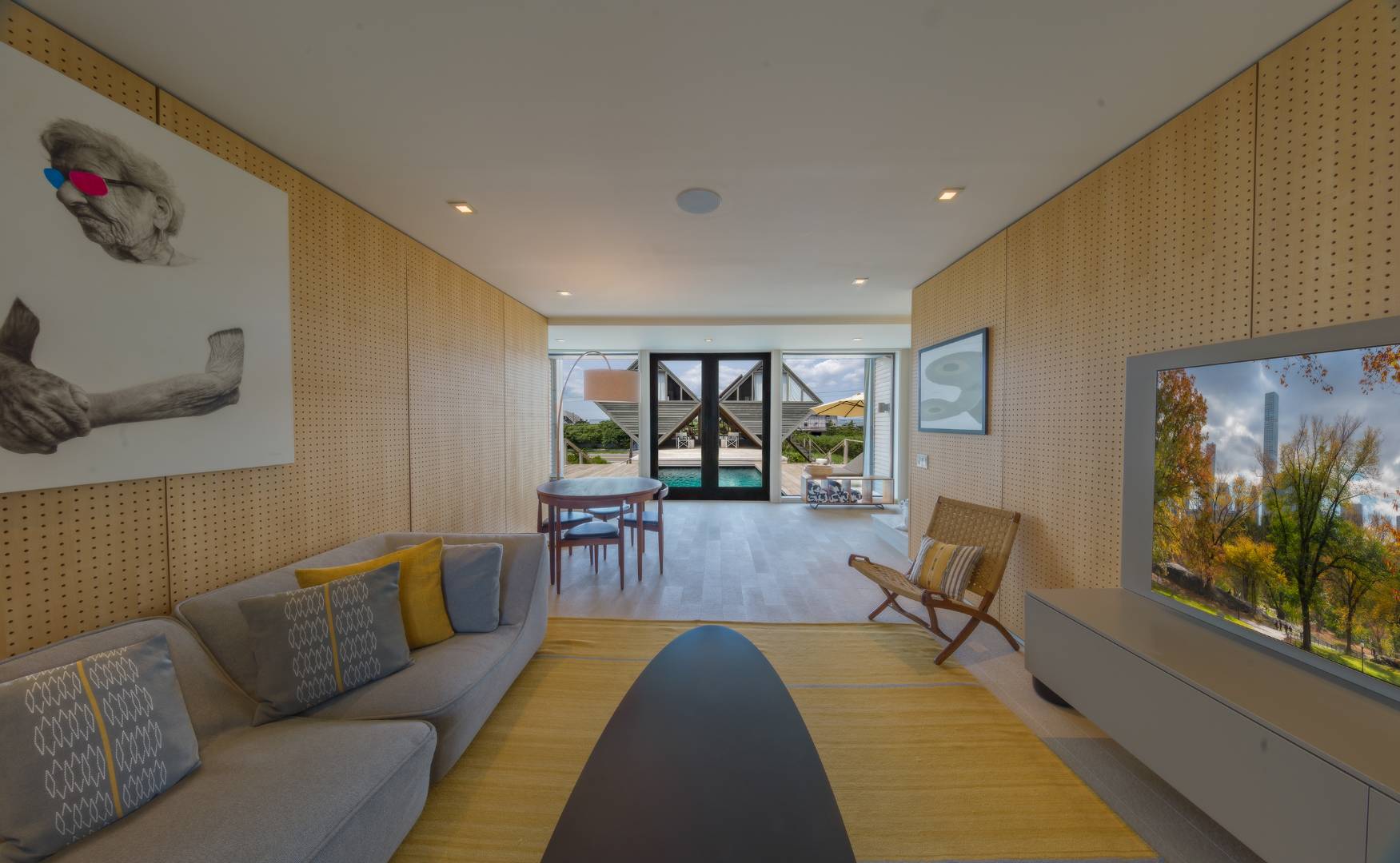 615 Dune Road Westhampton, NY 11978 - Photo 11 of 29 a living room with furniture and a flat screen tv