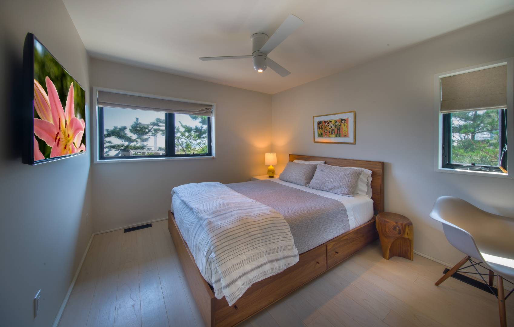 615 Dune Road Westhampton, NY 11978 - Photo 21 of 29 a bedroom with a bed and a painting on the wall