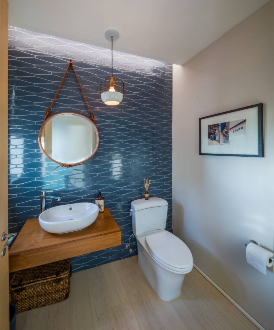 615 Dune Road Westhampton, NY 11978 - Photo 27 of 29 a bathroom with a toilet a sink and mirror