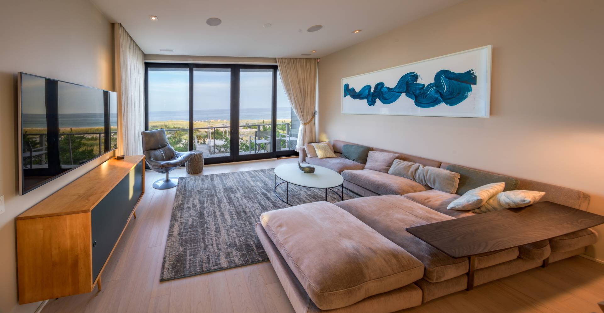 615 Dune Road Westhampton, NY 11978 - Photo 5 of 29 a living room with furniture and a flat screen tv