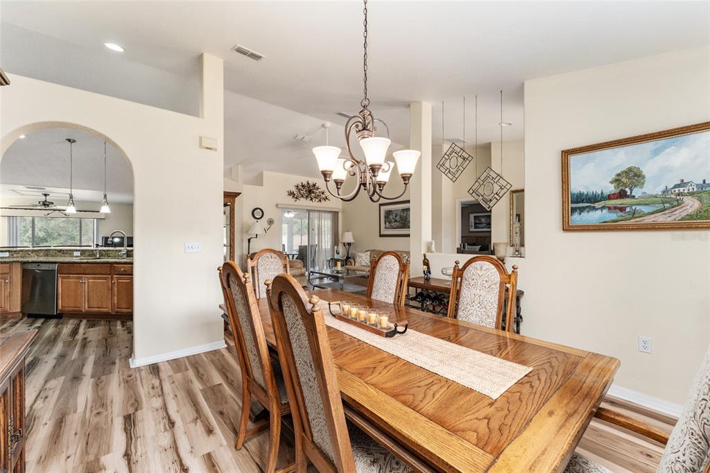 9910 Southeast 138th Loop Summerfield, FL 34491 - Photo 13 of 69 a view of kitchen and dining area with furniture