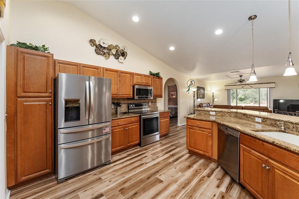 9910 Southeast 138th Loop Summerfield, FL 34491 - Photo 15 of 69 a kitchen with stainless steel appliances and refrigerator