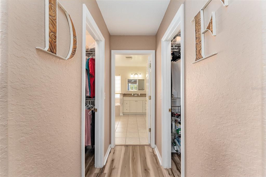 9910 Southeast 138th Loop Summerfield, FL 34491 - Photo 25 of 69 a view of a hallway with wooden floor and a door