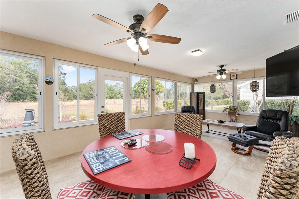 9910 Southeast 138th Loop Summerfield, FL 34491 - Photo 37 of 69 a living room with furniture and a large window