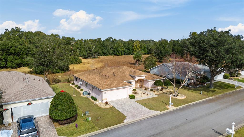 9910 Southeast 138th Loop Summerfield, FL 34491 - Photo 42 of 69 an aerial view of a house having yard
