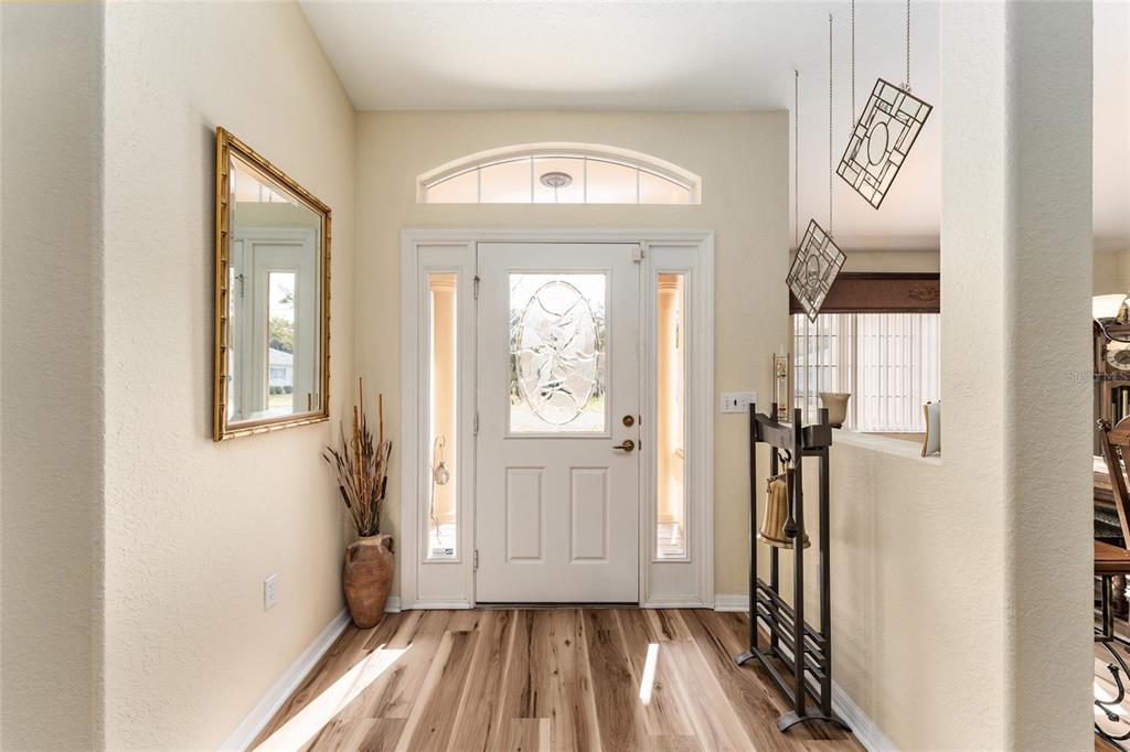 9910 Southeast 138th Loop Summerfield, FL 34491 - Photo 5 of 69 a view of a hallway view with wooden floor and staircase