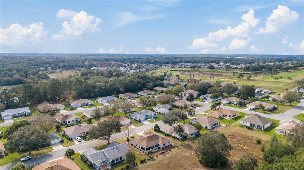 9910 Southeast 138th Loop Summerfield, FL 34491 - Photo 53 of 69 an aerial view of a house with a lake view