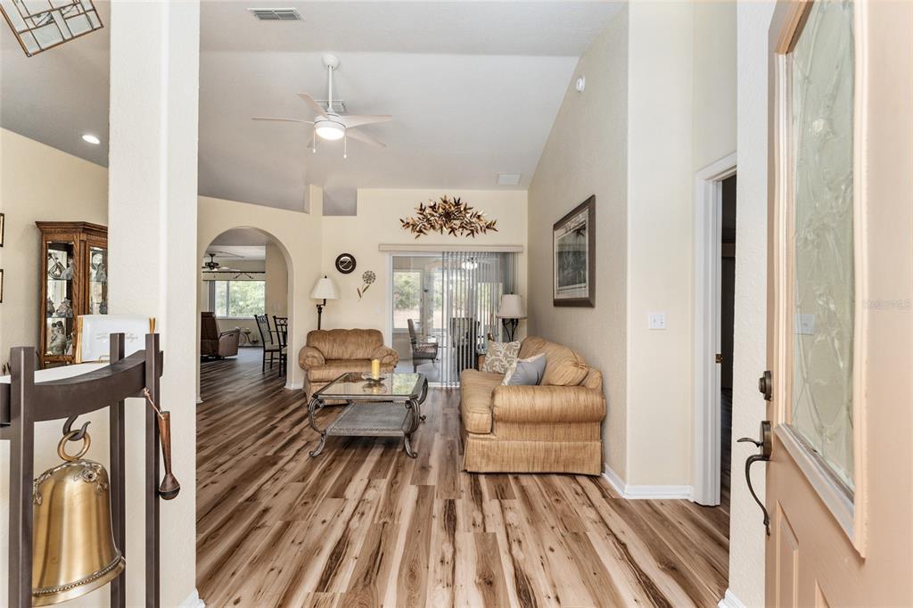 9910 Southeast 138th Loop Summerfield, FL 34491 - Photo 6 of 69 a living room with furniture fireplace and furniture