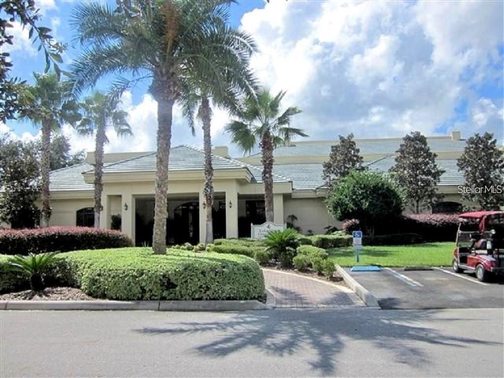 9910 Southeast 138th Loop Summerfield, FL 34491 - Photo 65 of 69 a front view of a house with a garden and trees