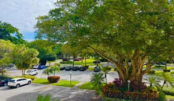 a view of backyard with swimming pool and seating area
