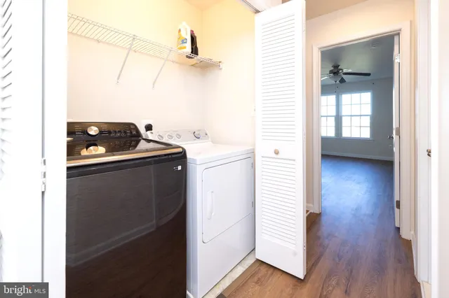 a bathroom with a granite countertop sink toilet a mirror and shower