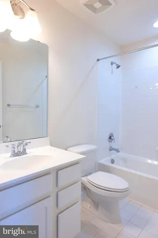 a utility room with closet dryer and washer