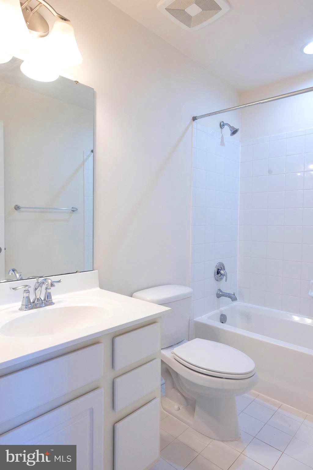 202 Fiesta Drive Stephenson, VA 22656 - Photo 18 of 33 a bathroom with a sink a toilet and shower