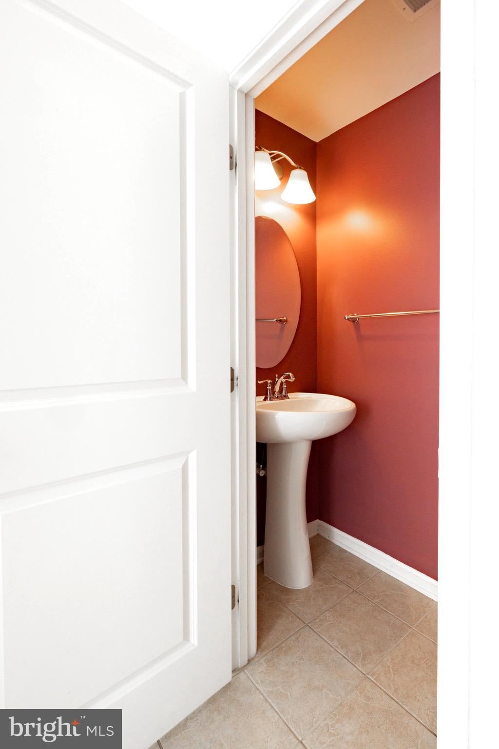 202 Fiesta Drive Stephenson, VA 22656 - Photo 23 of 33 a bathroom with a sink a mirror and a toilet