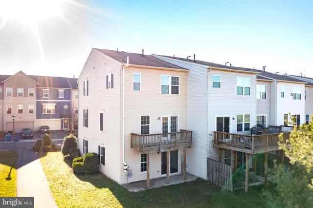 a view of yellow house with a large window