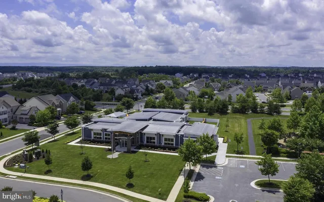 an aerial view of a house with outdoor space
