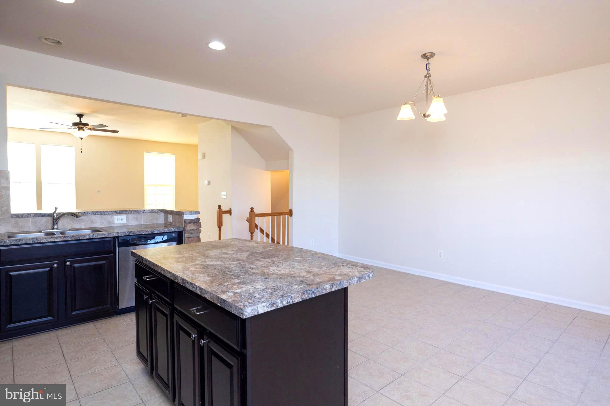 202 Fiesta Drive Stephenson, VA 22656 - Photo 4 of 33 a kitchen with a counter space and sink