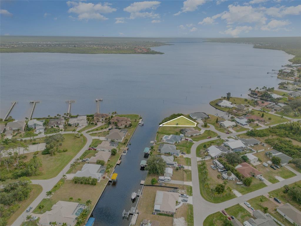 3528 Fox Terrace Port Charlotte, FL 33981 - Photo 2 of 12 an aerial view of a house with a lake view