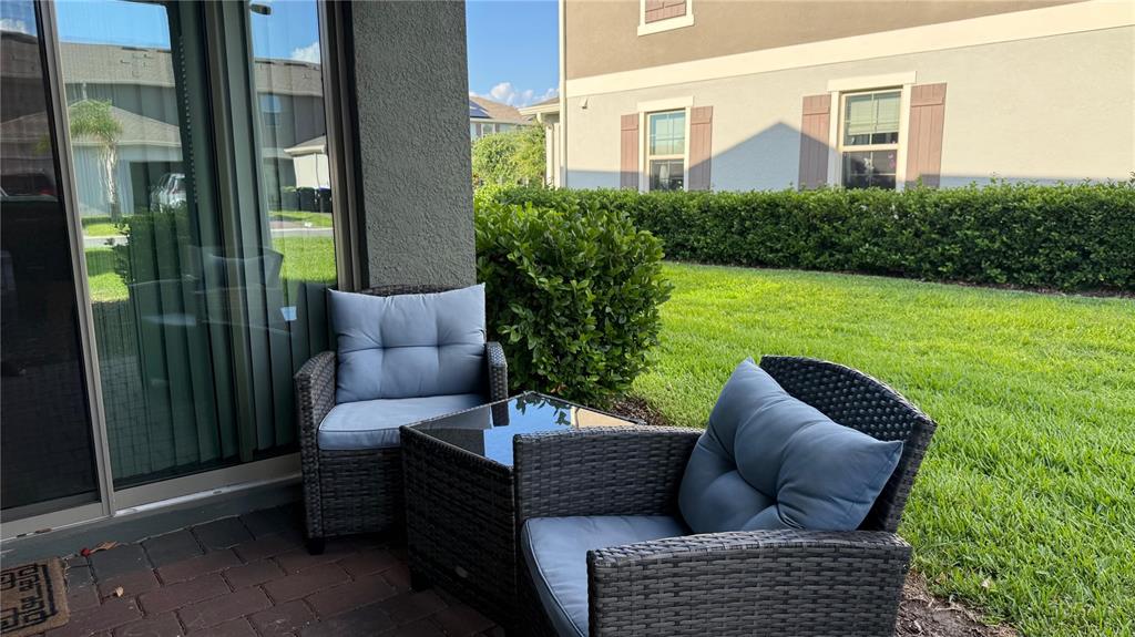 13340 Pontoon Road Winter Garden, FL 34787 - Photo 9 of 15 a view of a patio with couches chairs and a yard