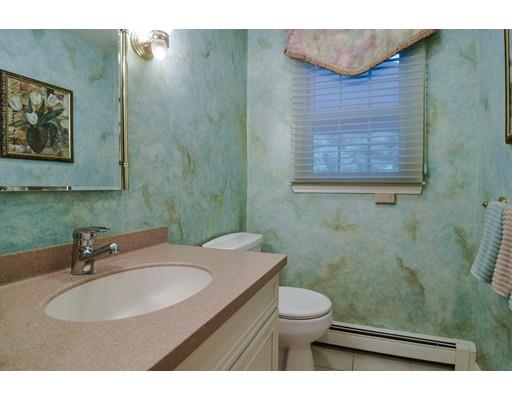11 Parmenter Road Framingham, MA 01701 - Photo 16 of 24 a bathroom with a sink a toilet and mirror