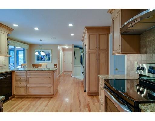 11 Parmenter Road Framingham, MA 01701 - Photo 5 of 24 a kitchen view with granite countertop a stove a sink and a refrigerator