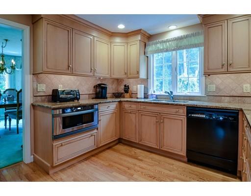 11 Parmenter Road Framingham, MA 01701 - Photo 6 of 24 a kitchen with stainless steel appliances granite countertop a stove a sink and a microwave