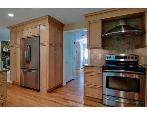 11 Parmenter Road Framingham, MA 01701 - Photo 7 of 24 a kitchen with appliances and cabinets