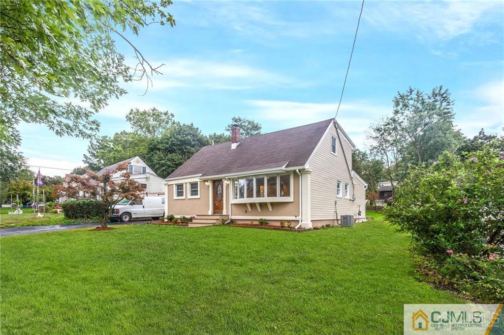 65 Tunison Road New Brunswick, NJ 08901 - Photo 1 of 22 a view of a house with a big yard plants and large trees
