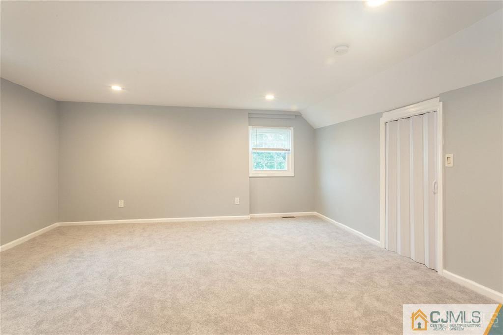 65 Tunison Road New Brunswick, NJ 08901 - Photo 11 of 22 a view of an empty room with a window