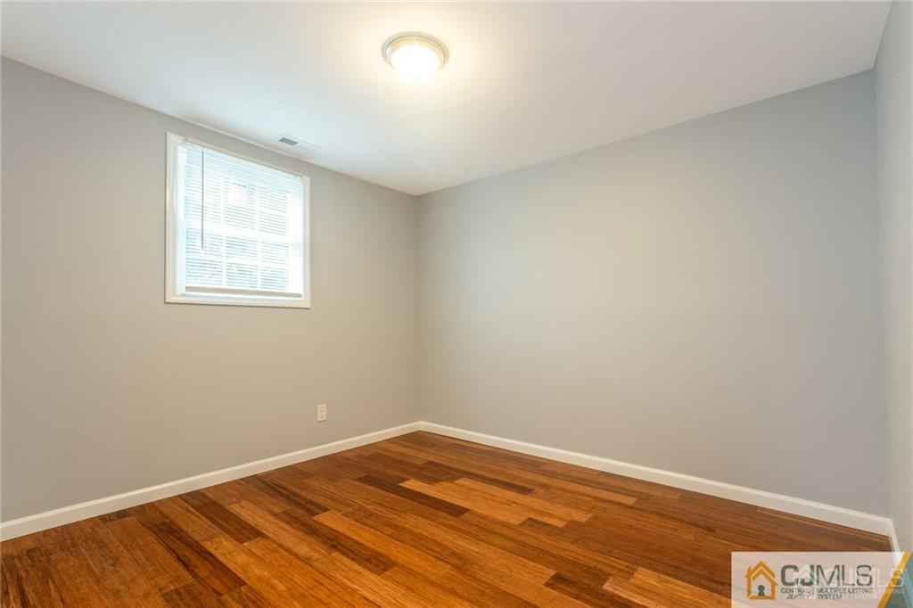 65 Tunison Road New Brunswick, NJ 08901 - Photo 16 of 22 an empty room with a window