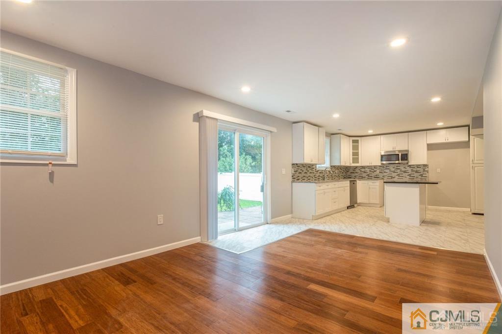 65 Tunison Road New Brunswick, NJ 08901 - Photo 9 of 22 a view of a kitchen with wooden floor and windows