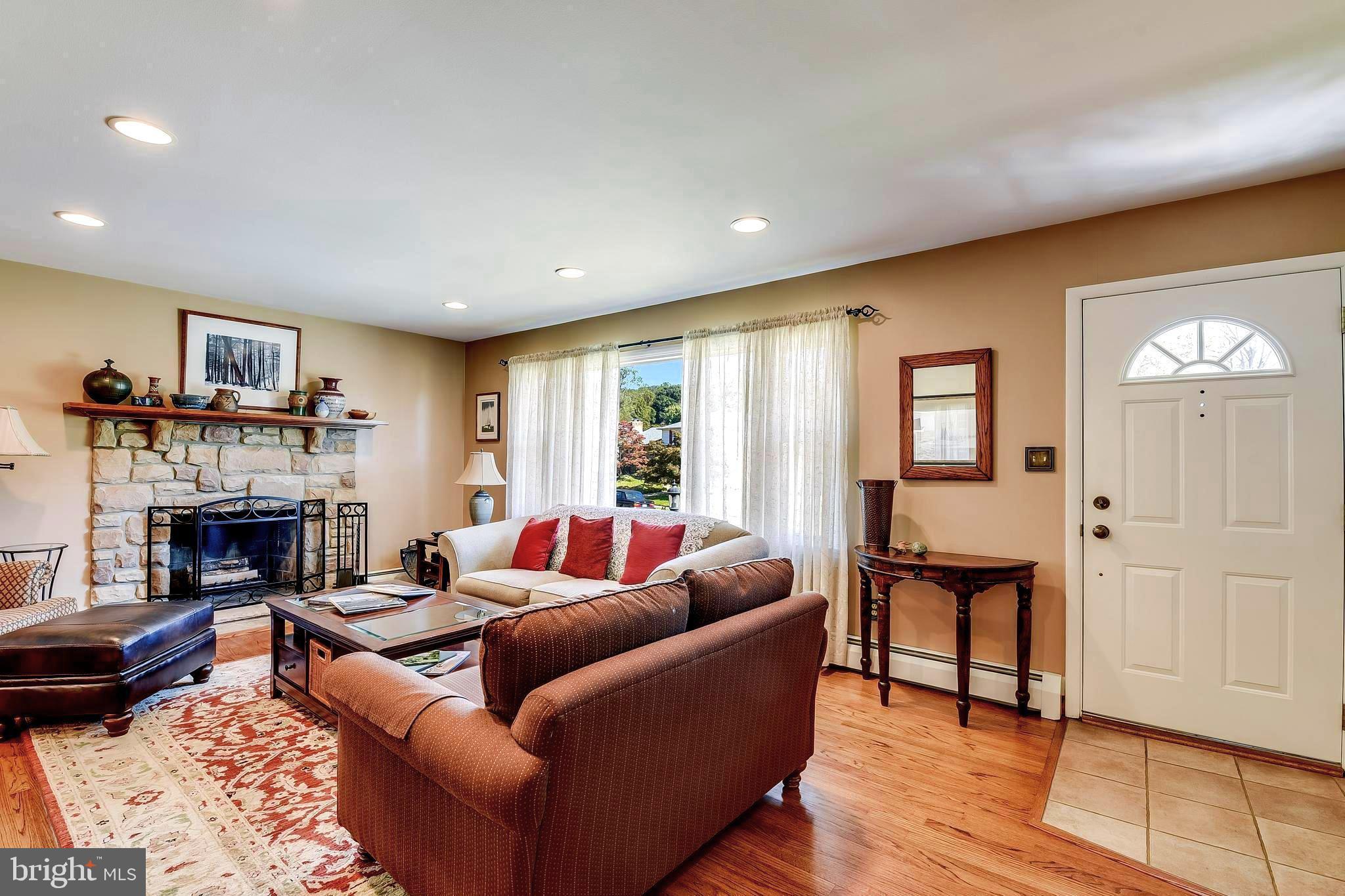 116 Hollowbrook Road Lutherville-Timonium, MD 21093 - Photo 6 of 38 Living room with wood burning FP